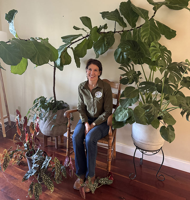 Julie Sitting with House Plants