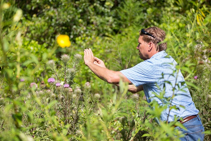 Matt Photographing a Butterfly