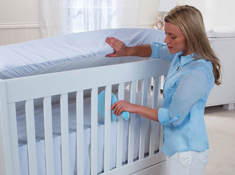 Mom Holding Vibrating Mattress Pad