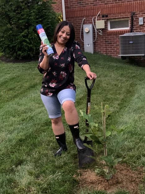 Lady planting gift tree