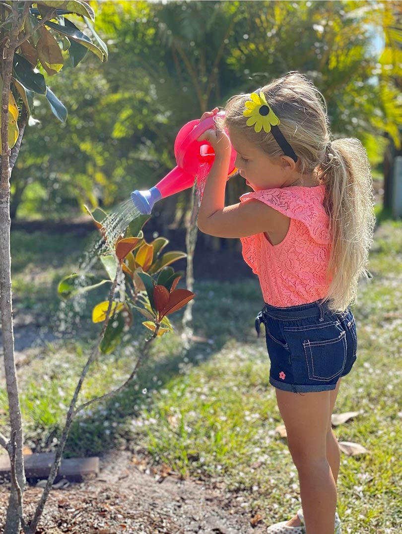 Girl Watering Pet Sympathy Magnolia Tree